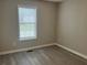 Neutral bedroom featuring new floors, base trim and a window at 109 Ivy Crest Dr, Dallas, GA 30157