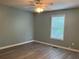 Cozy bedroom features updated flooring, a ceiling fan, and natural light from the window at 109 Ivy Crest Dr, Dallas, GA 30157
