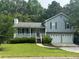 Charming two-story home with a well-manicured lawn and a two-car garage at 109 Ivy Crest Dr, Dallas, GA 30157