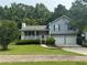 Charming two-story home with a well-manicured lawn and a two-car garage at 109 Ivy Crest Dr, Dallas, GA 30157