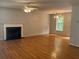 A spacious living room features a fireplace, hardwood floors, and plenty of natural light at 109 Ivy Crest Dr, Dallas, GA 30157