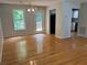 Spacious living room with hardwood floors leads to a back porch at 109 Ivy Crest Dr, Dallas, GA 30157
