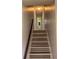 Staircase featuring modern flooring and a dark wood handrail at 109 Ivy Crest Dr, Dallas, GA 30157