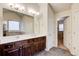 Bright bathroom featuring a double sink vanity, soaking tub, and separate toilet room at 3746 Okefenokee Rdg, Loganville, GA 30052