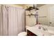Neutral bathroom features decorative shelves above toilet, white countertop, and walk-in shower at 3746 Okefenokee Rdg, Loganville, GA 30052
