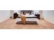 Spacious bedroom with soft carpeting, a comfortable bed, side tables, and lamps at 3746 Okefenokee Rdg, Loganville, GA 30052