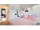 Comfortable bedroom featuring carpet flooring, decorative wall art, and a well-lit window at 3746 Okefenokee Rdg, Loganville, GA 30052
