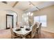 Elegant dining room featuring tray ceilings, a chandelier, and sophisticated decor at 3746 Okefenokee Rdg, Loganville, GA 30052