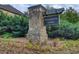 Stone entryway sign with decorative landscaping that reads: Shannon Lake at 3746 Okefenokee Rdg, Loganville, GA 30052