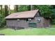 Quaint house with unique windows complemented by a grassy yard at 4567 Town Crier Sw Rd, Lilburn, GA 30047
