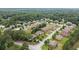 An aerial view shows the home nestled in a neighborhood with tree-lined streets at 1241 Edgebrook Ln, Snellville, GA 30078