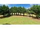 Large grassy backyard featuring well-maintained lawn and mature trees at 1241 Edgebrook Ln, Snellville, GA 30078