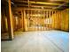 Unfinished basement with wooden framing and exposed ceiling, ready for customization and expansion at 1241 Edgebrook Ln, Snellville, GA 30078