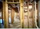 Unfinished basement showing wooden framing and ductwork, providing potential for future living space at 1241 Edgebrook Ln, Snellville, GA 30078
