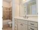 Bathroom featuring tiled shower, vanity with drawers and a sink at 1241 Edgebrook Ln, Snellville, GA 30078