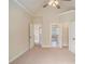 Large carpeted bedroom with adjacent ensuite bathroom and walk-in closet at 1241 Edgebrook Ln, Snellville, GA 30078