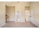 Spacious bedroom with carpet and adjacent ensuite and closet at 1241 Edgebrook Ln, Snellville, GA 30078