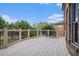 A spacious wooden deck with black metal railing overlooks a lush, green backyard at 1241 Edgebrook Ln, Snellville, GA 30078