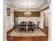 Dining room with hardwood floors, wainscoting, and a chandelier at 1241 Edgebrook Ln, Snellville, GA 30078
