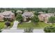 Beautiful two-story home with manicured lawn, stone accents, mature trees, and a long driveway at 1241 Edgebrook Ln, Snellville, GA 30078