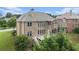 An aerial view of a large brick home featuring a deck and backyard at 1241 Edgebrook Ln, Snellville, GA 30078