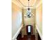 The foyer features a grand chandelier at 1241 Edgebrook Ln, Snellville, GA 30078
