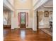Foyer featuring high ceilings, hardwood floors, and decorative columns at 1241 Edgebrook Ln, Snellville, GA 30078