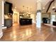 Open concept kitchen with granite countertops, a center island, and hardwood floors at 1241 Edgebrook Ln, Snellville, GA 30078