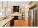 Kitchen with stainless steel appliances, granite countertops, and custom cabinets at 1241 Edgebrook Ln, Snellville, GA 30078