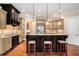 Kitchen with granite countertops, stainless steel appliances, and a bar with stools at 1241 Edgebrook Ln, Snellville, GA 30078