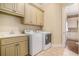 Laundry room featuring a sink and modern washer and dryer at 1241 Edgebrook Ln, Snellville, GA 30078