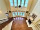 A two story great room with hardwood floors, fireplace, and a ceiling fan at 1241 Edgebrook Ln, Snellville, GA 30078