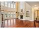 A grand living room featuring hardwood floors, a fireplace, and bright windows at 1241 Edgebrook Ln, Snellville, GA 30078