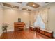 Living room featuring coffered ceilings, hardwood floors, large windows, and a piano at 1241 Edgebrook Ln, Snellville, GA 30078