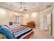 This spacious main bedroom has a fireplace, trey ceiling, and a ceiling fan at 1241 Edgebrook Ln, Snellville, GA 30078