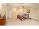 This spacious main bedroom has a trey ceiling and is carpeted at 1241 Edgebrook Ln, Snellville, GA 30078