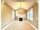 Bright sitting room with a fireplace, large windows, and neutral carpet flooring at 1241 Edgebrook Ln, Snellville, GA 30078
