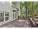 View of the back deck with door leading to the backyard with wooded view at 220 Chinkapin Sw Cir, South Fulton, GA 30311