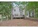 Exterior of home featuring a back deck and wooded surroundings at 220 Chinkapin Sw Cir, South Fulton, GA 30311