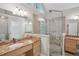 Modern bathroom with glass shower, stone details, and dual vanities at 220 Chinkapin Sw Cir, South Fulton, GA 30311