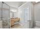 Bathroom with marble countertop, glass shower, and walk-in closet at 220 Chinkapin Sw Cir, South Fulton, GA 30311