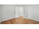 Bedroom with hardwood floors, closet, and bright natural light at 220 Chinkapin Sw Cir, South Fulton, GA 30311