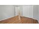 Bedroom with hardwood floors, closet, and neutral paint at 220 Chinkapin Sw Cir, South Fulton, GA 30311