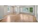 Large main bedroom features large windows that bring in natural light and hardwood floors at 220 Chinkapin Sw Cir, South Fulton, GA 30311