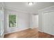 Bedroom featuring hardwood floors, window, and closet at 220 Chinkapin Sw Cir, South Fulton, GA 30311