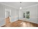 Elegant dining room with decorative wall trim, wood floors, and stylish pendant lighting at 220 Chinkapin Sw Cir, South Fulton, GA 30311