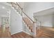 Entryway features hardwood floors, stairs to the second floor, and views of the kitchen at 220 Chinkapin Sw Cir, South Fulton, GA 30311