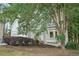 A two-story home nestled among trees features bay windows and mature landscaping at 220 Chinkapin Sw Cir, South Fulton, GA 30311