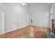 Bright room with hardwood floors, high ceilings, and a tiled fireplace at 220 Chinkapin Sw Cir, South Fulton, GA 30311
