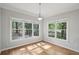 Sun-filled living room with hardwood floors and view to outdoor deck at 220 Chinkapin Sw Cir, South Fulton, GA 30311